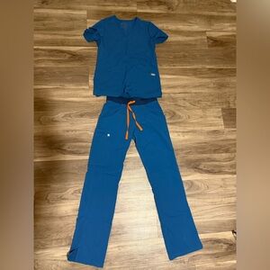 Figs Blue scrubs with orange accents